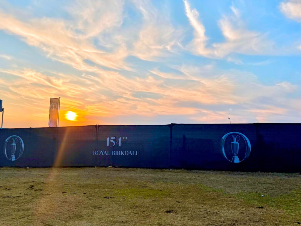 signage and sunset on day 1 of attending the open championship